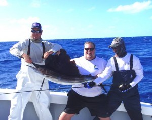 (L to R) Donny Lange, Mike Rempe with first Atlantic Sailfish on Fly and Mark Johnson