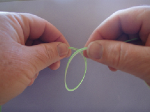 Pay attention - start out correctly. Make a downward loop with tippet side (right side) overlapping on top.