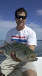 Fly angler, Matt Saxe, with a nice June fish taken in 24" of clear saltwater.