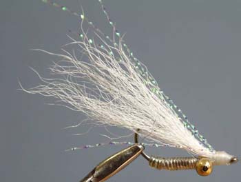 Crazy Charlie, Hook: Regular saltwater hook, sizes 8 to 4. Thread: Size 6/0 (140 denier), color to complement the wing. Body: Silver, gold, or pearl tinsel, and clear medium D-Rib. Eyes: Small bead chain. Wing: White, tan, pink, or chartreuse calftail.