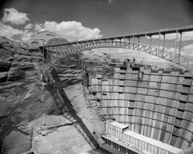 With passage of CRSPA, and allocation of $760 million in federal funds for Flaming Gorge and Glen Canyon, construction on Glen Canyon Dam began in late 1956. Upon its completion in 1966 its impounded waters (named Lake Powell after General John Wesley Powell who had first navigated the whole of the Colorado River in 1869) could reach a full capacity of 26, 214,900 acre feet, making it the second largest development along the Colorado after Lake Mead. The construction of the Glen Canyon Dam has long served as a significant moment of loss for many who were able to witness Glen Canyon before it was flooded by the dam. Bureau of Reclamation image. 