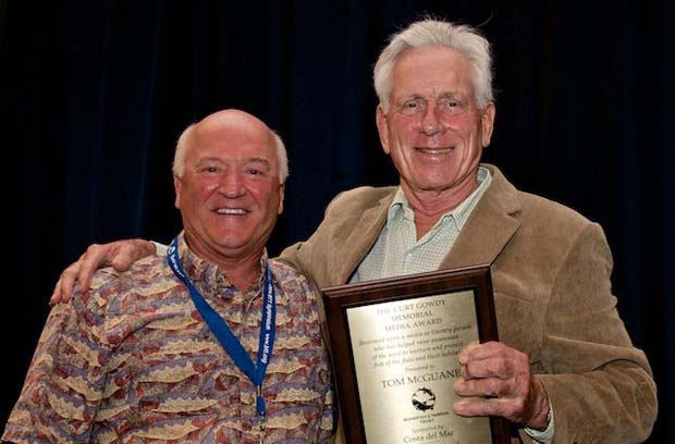 Bill Klyn (L), Co-Chairman of Membership for Bonefish & Tarpon Trust, presents author Tom McGuane with the Curt Gowdy Media Memorial Award at the Bonefish and Tarpon Trust’s 5th International Symposium in 2014. Photo by Pat Ford. 
