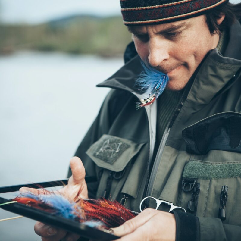 Middle aged man fly fishing on the Hoh River, Olympic National Park, Washington.