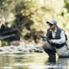 Fly fisherman using flyfishing rod.