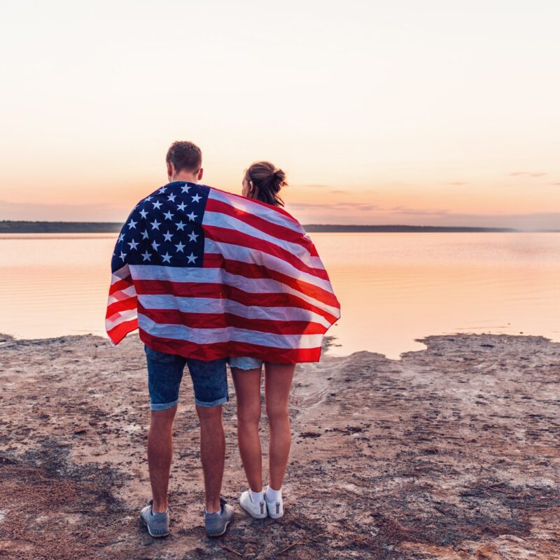 oung couple on the beach walking together