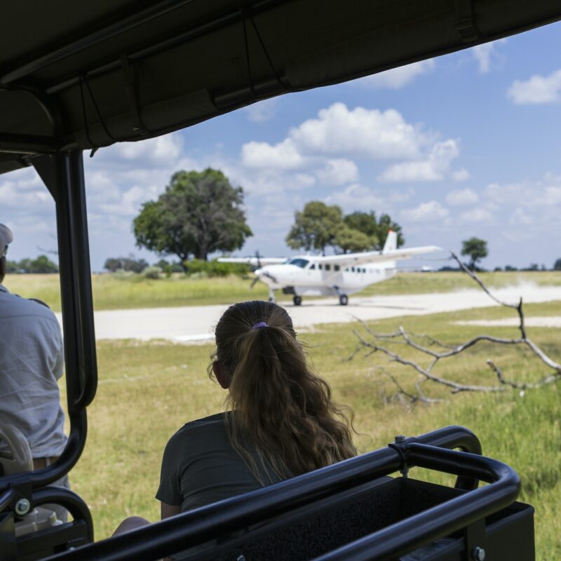 bush plane on dirt runway,landing, Botswana