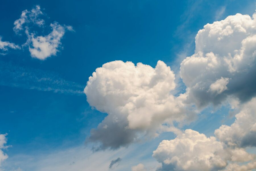 White, Fluffy Clouds In Blue Sky. Background From Clouds.