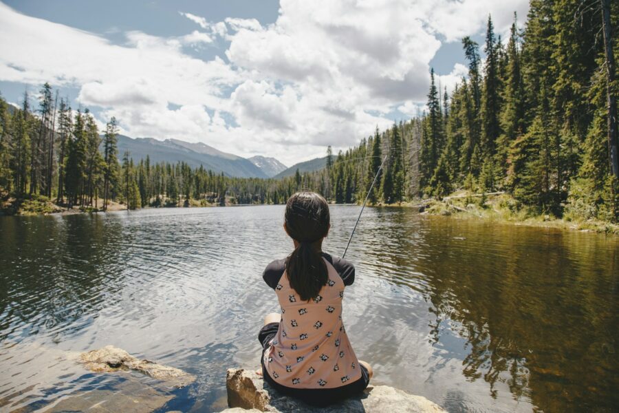 Young girl fishing at the lake